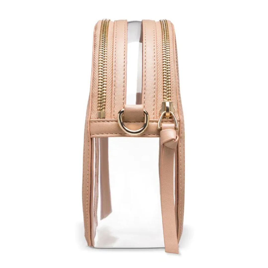 A clear bag with tan leather trim and a strap.