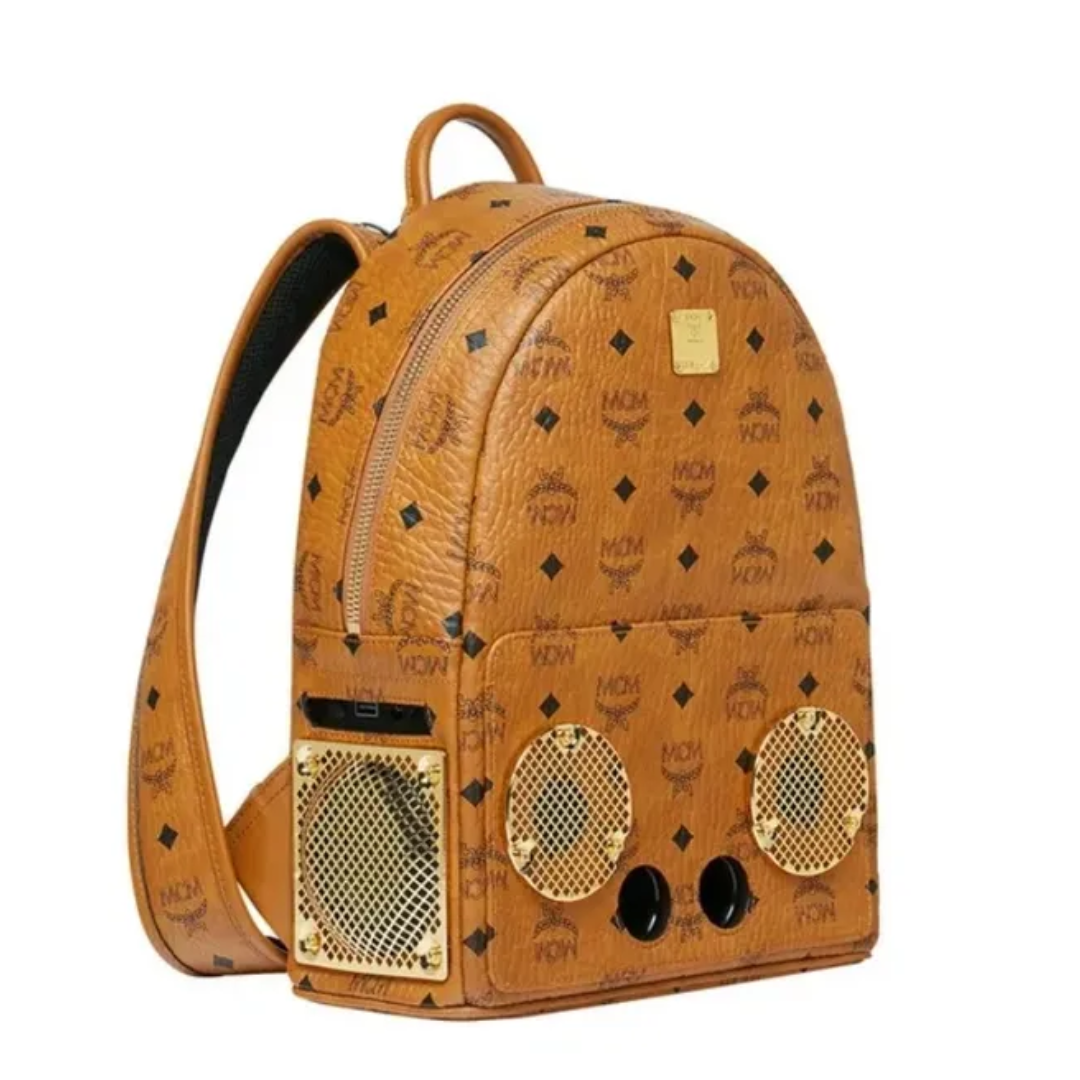 A brown backpack with speakers on the front.