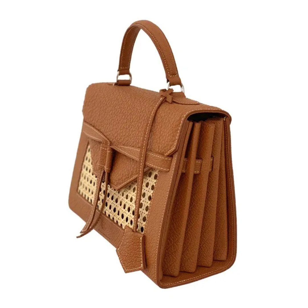 A brown bag with a woven design on it.